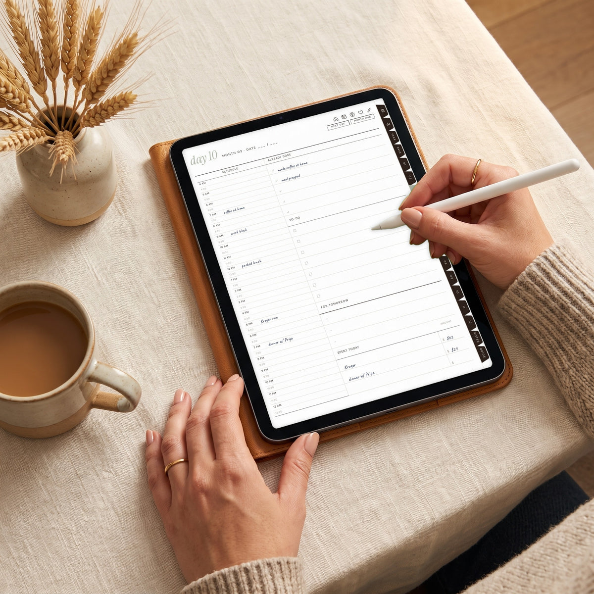 Writing on the budget daily page on an iPad with an Apple Pencil