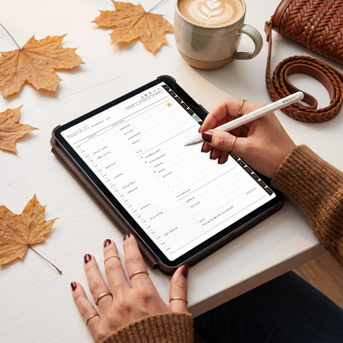 Writing on the 2027 daily planner page on an iPad with an Apple Pencil