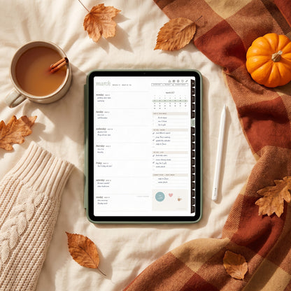 2027 weekly spread on an iPad in a sage case on cozy fall bedding