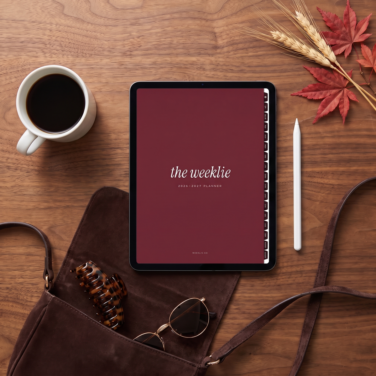 The 2026-2027 digital planner cherry cover on an iPad on a walnut desk with coffee